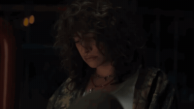 A Person Is Holding A Box That Has A Circle In The Middle GIF