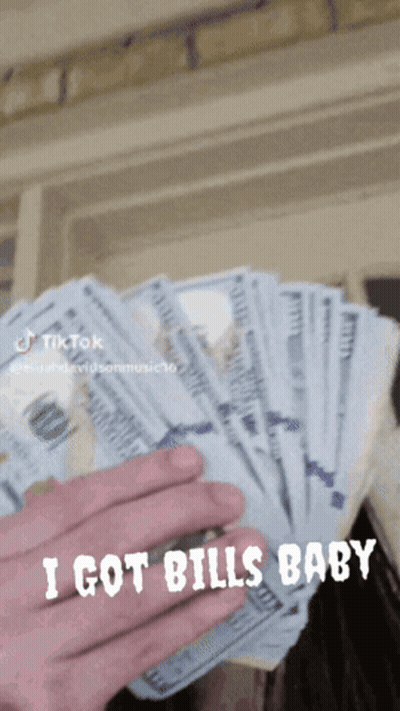 A Person Is Holding A Bunch Of Money And The Caption Says I Got Bills Baby GIF