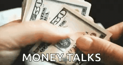 A Person Is Holding A Bunch Of Money In Their Hands And Says `` Money Talks '' . GIF