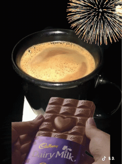 A Person Is Holding A Cadbury Dairy Milk Chocolate Bar GIF