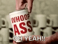 A Person Is Holding A Can Of Whoop Ass Oh Yeah . GIF