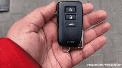 A Person Is Holding A Car Key In Their Hand That Says Ce On It GIF