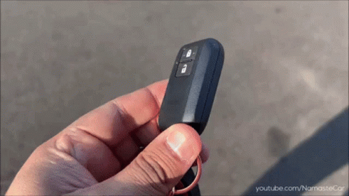 A Person Is Holding A Car Key In Their Hand With Youtube.com In The Corner GIF