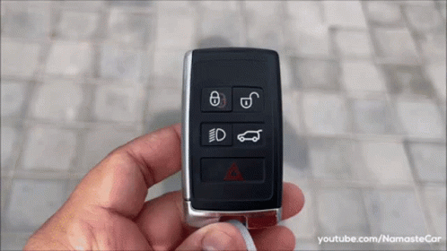 A Person Is Holding A Car Key With A Youtube Link At The Bottom Of The Screen GIF