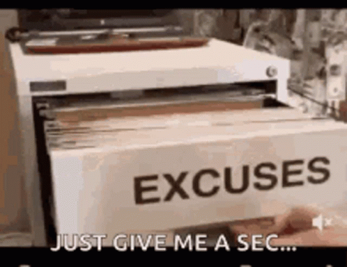 A Person Is Holding A Card That Says Excuses In A Filing Cabinet . GIF