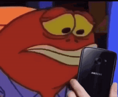 A Person Is Holding A Cell Phone In Front Of A Cartoon Character With A Sad Face . GIF