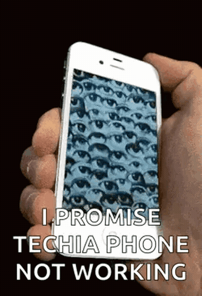 A Person Is Holding A Cell Phone In Their Hand With A Picture Of Eyes On It . GIF
