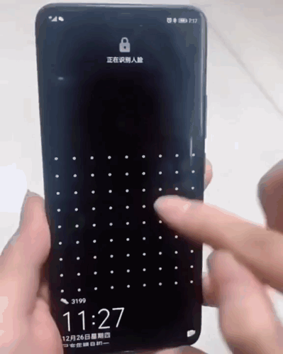 A Person Is Holding A Cell Phone That Says 11:27 On It GIF