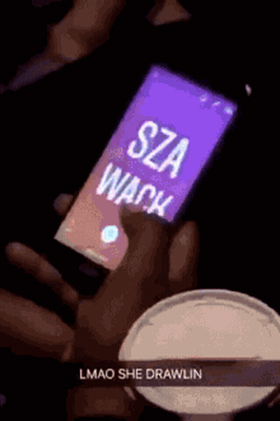 A Person Is Holding A Cell Phone That Says Sza Wack On It GIF
