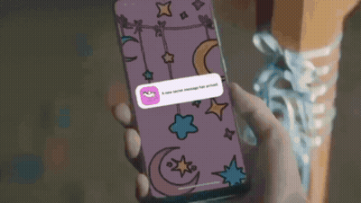 A Person Is Holding A Cell Phone With A New Secret Message On It GIF