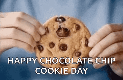 A Person Is Holding A Chocolate Chip Cookie With The Words Happy Chocolate Chip Cookie Day GIF