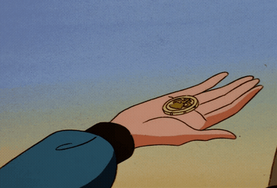 A Person Is Holding A Coin In Their Hand That Has The Letter S On It GIF