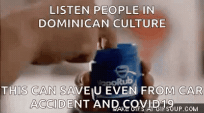 A Person Is Holding A Container Of Vaporub In Their Hands . GIF