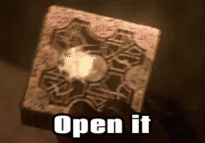 A Person Is Holding A Cube That Says Open It GIF