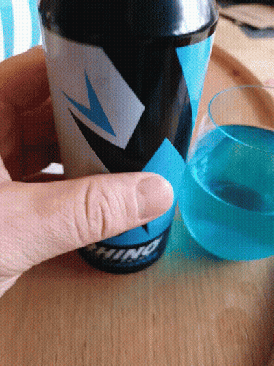 A Person Is Holding A Cup That Says ' Ninja ' On The Side GIF