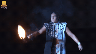 A Person Is Holding A Fireball In Front Of A Sign That Says ' Captain Star ' GIF