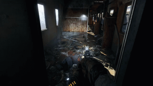 A Person Is Holding A Gun In A Room With A Ladder And A Chair GIF