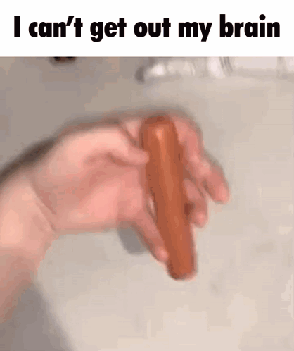 A Person Is Holding A Hot Dog In Their Hand And Says I Can 'T Get Out My Brain . GIF