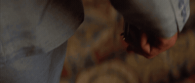 A Person Is Holding A Knife In Their Hand In A Blurry Photo GIF
