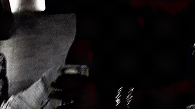 A Person Is Holding A Large Stack Of Money In Their Hand . GIF