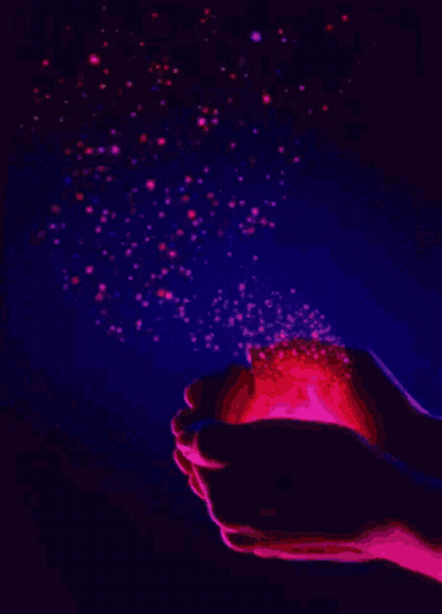 A Person Is Holding A Light In Their Hands With Stars Coming Out Of It GIF