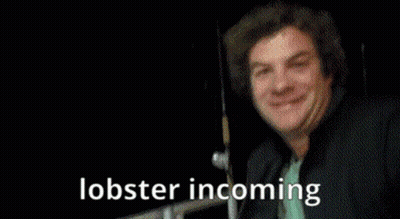 A Person Is Holding A Lobster With The Words Lobster Incoming Written Below It GIF