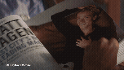A Person Is Holding A Magazine With A Picture Of A Man On It And The Caption #Clayfacemovie GIF