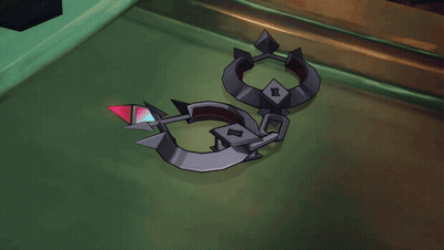 A Person Is Holding A Pair Of Handcuffs With A Red Diamond In The Middle GIF