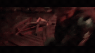 A Person Is Holding A Pair Of Scissors In Their Right Hand GIF