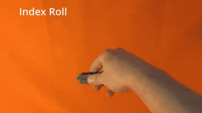 A Person Is Holding A Pair Of Scissors With The Words Index Roll Written Above Them GIF