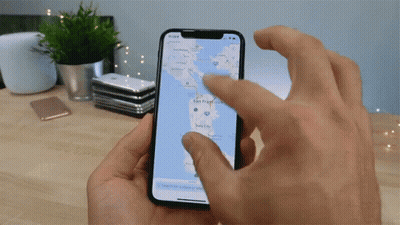 A Person Is Holding A Phone With A Map On It GIF