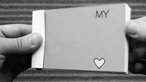 A Person Is Holding A Piece Of Paper That Says My With A Heart On It GIF