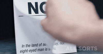 A Person Is Holding A Piece Of Paper That Says No On It GIF