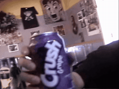 A Person Is Holding A Purple Crush Grape Soda GIF