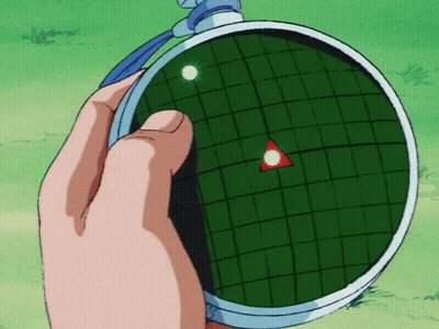 A Person Is Holding A Radar That Has A Red Triangle In The Center GIF
