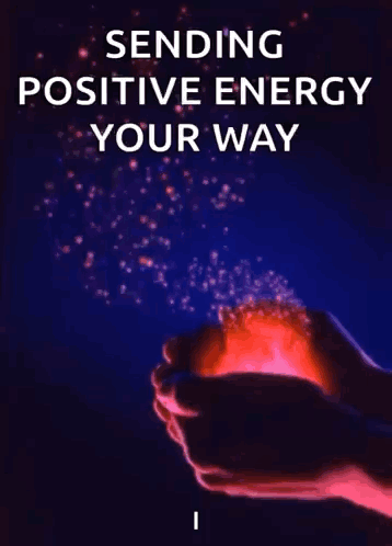 A Person Is Holding A Red Ball In Their Hands With The Words Sending Positive Energy Your Way . GIF