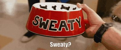 A Person Is Holding A Red Bowl That Says Sweaty On It GIF