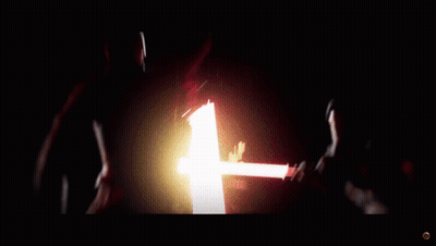A Person Is Holding A Red Light Saber In Their Hand GIF