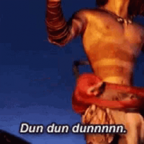 A Person Is Holding A Red Object In Their Hand And Saying Dun Dun Dunnnn . GIF