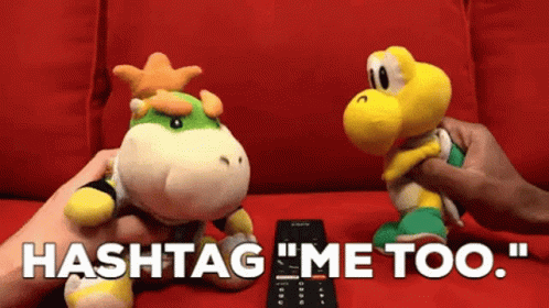 A Person Is Holding A Remote Control Next To Two Stuffed Animals That Say Hashtag Me Too GIF