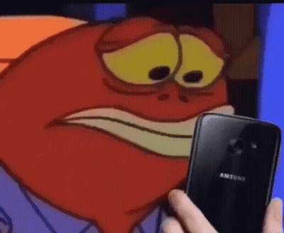 A Person Is Holding A Samsung Phone In Front Of A Cartoon Character 'S Face . GIF