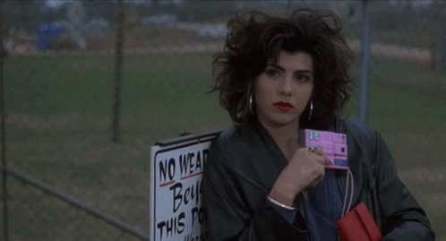 A Person Is Holding A Sign That Says No Wear Boys On It GIF