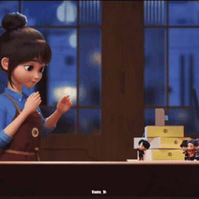 A Person Is Holding A Small Toy In Their Hand . GIF