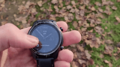 A Person Is Holding A Smart Watch In Their Hand And It Shows The Time As 13:53 GIF
