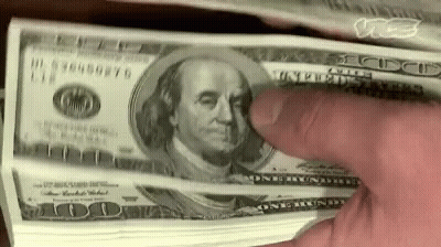 A Person Is Holding A Stack Of 100 Dollar Bills With Their Finger . GIF
