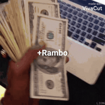 A Person Is Holding A Stack Of Money With The Words + Rambo On It GIF