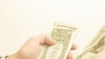 A Person Is Holding A Stack Of One Dollar Bills . GIF