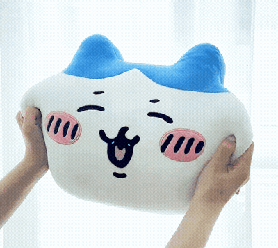 A Person Is Holding A Stuffed Animal That Looks Like A Pig GIF