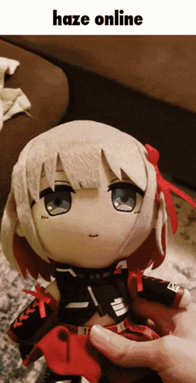 A Person Is Holding A Stuffed Doll That Says Haze Online On It GIF