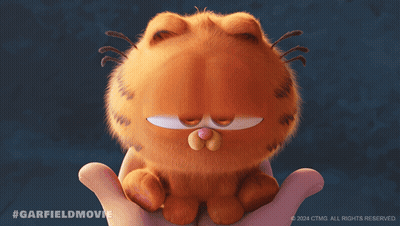 A Person Is Holding A Stuffed Garfield Cat GIF